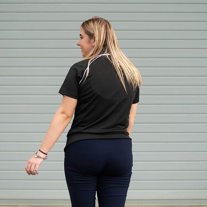 Back View of lady wearing the Ladies Bamboo Cotton Polo in Black by Southern Cross Workwear